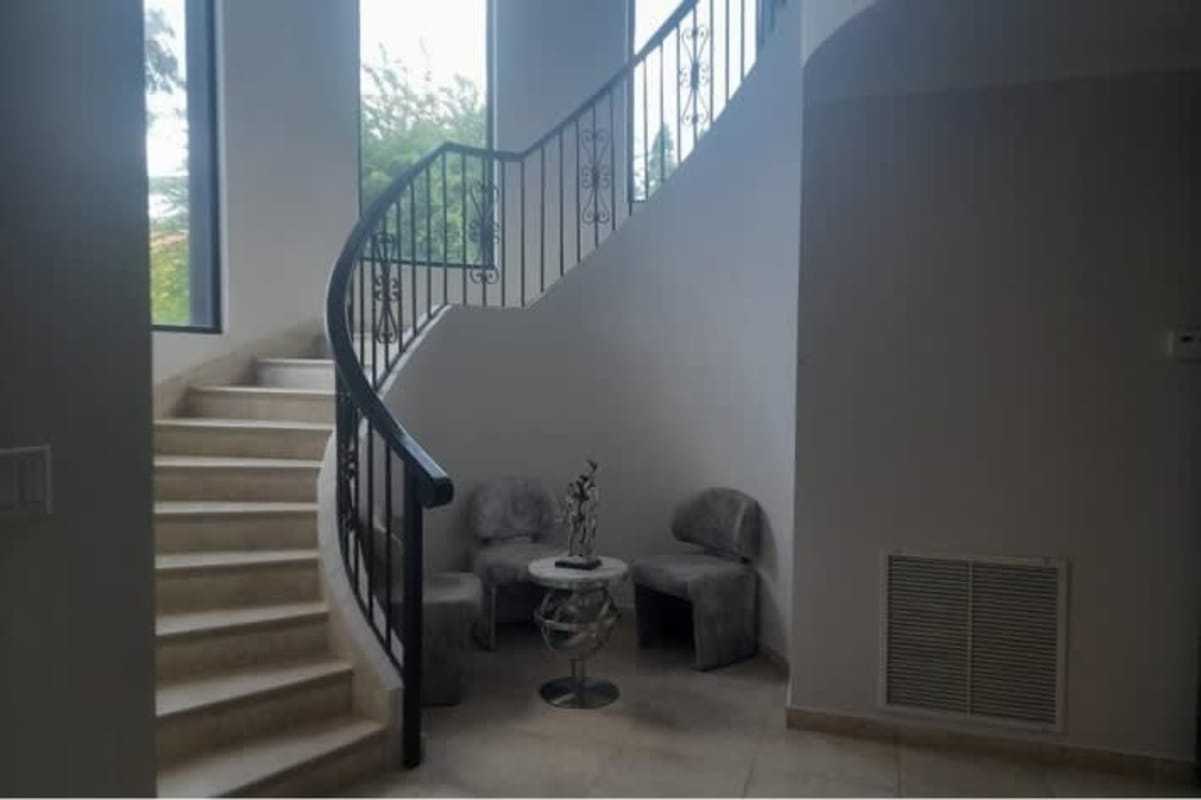 Spacious foyer with curved staircase large windows and contemporary decor Costa del Este Panama
