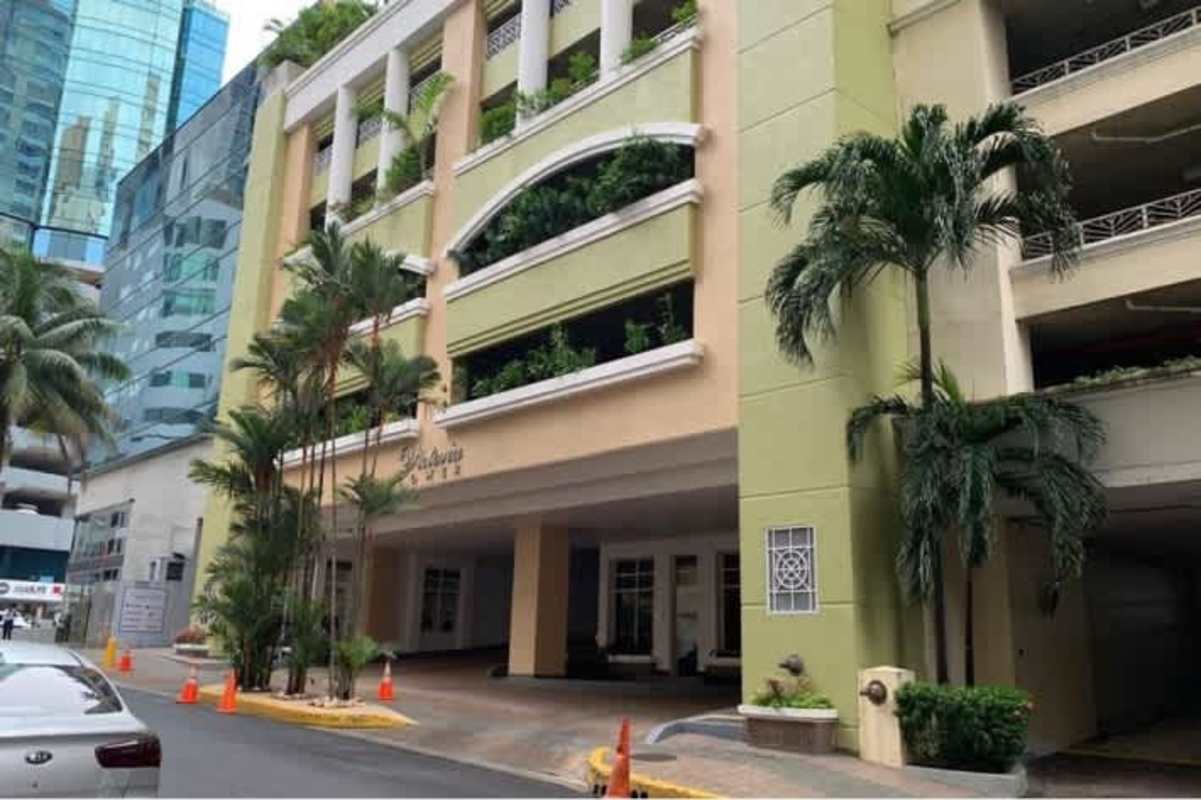 Spacious living room with floor-to-ceiling windows and tray ceiling in Victoria Tower Obarrio Panama City