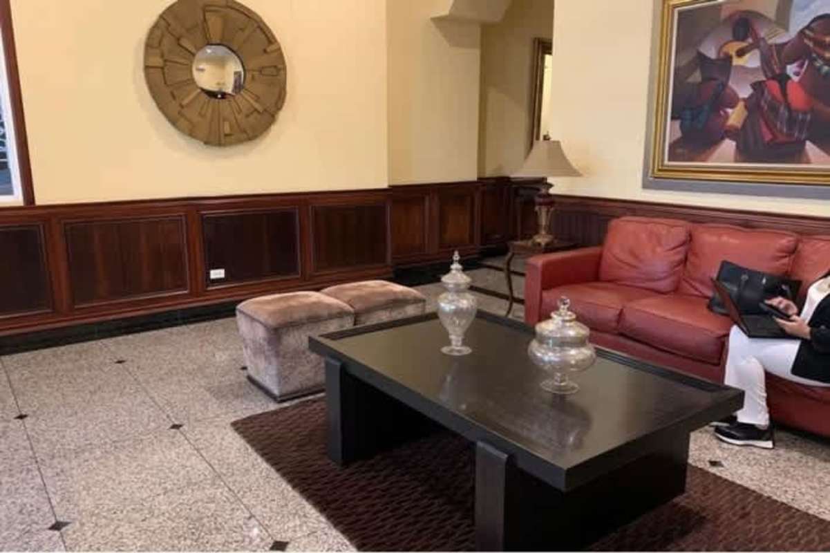 Bright bedroom with city view window in Victoria Tower Obarrio Panama