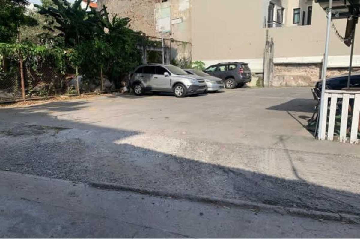Urban gated commercial lot with fence and nearby cityscape Casco Viejo Panama