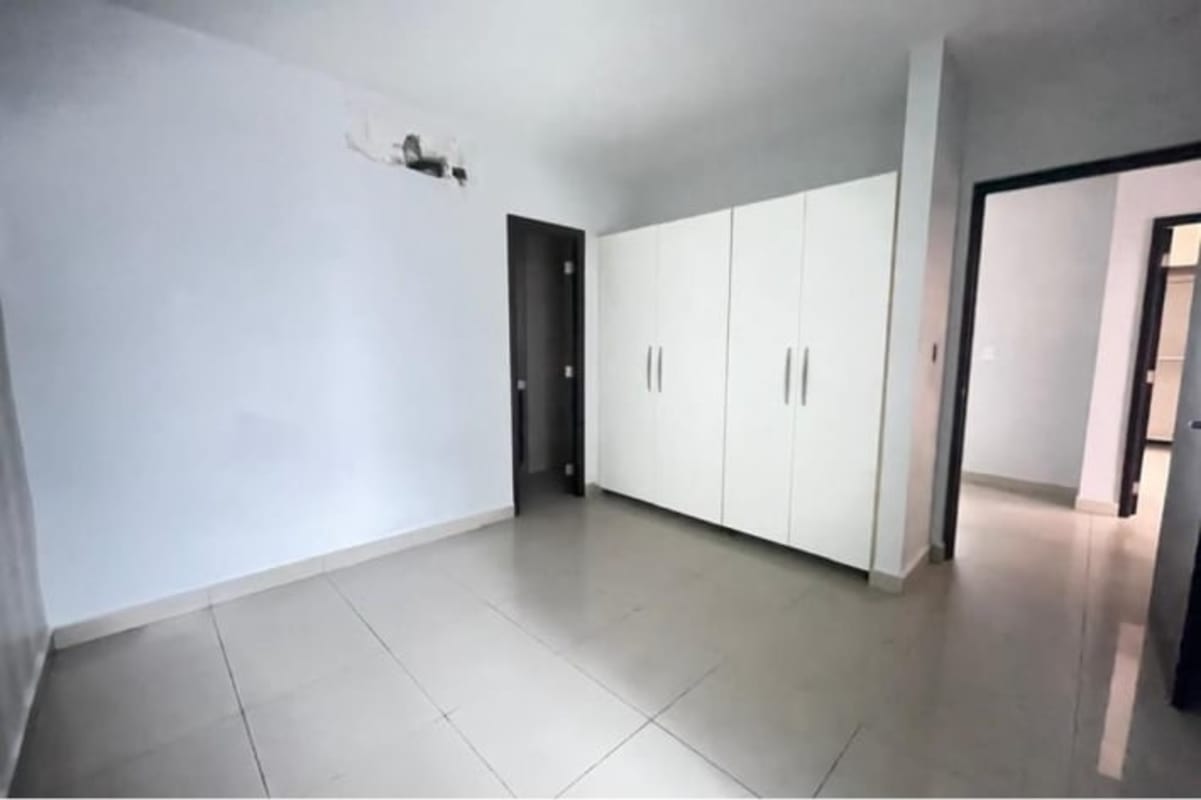 Modern living dining room with large floor-to-ceiling windows, balcony, tiled floors in PH San Francisco Bay Panama City