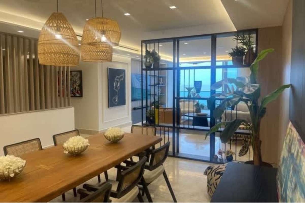 Suite bedroom with floor-to-ceiling windows and bay view at PH Costanera Avenida Balboa Panama