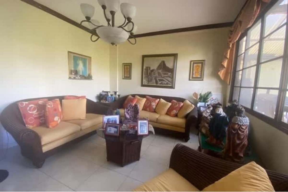 Compact bathroom with pedestal sink and tiled walls Las Cumbres Panama