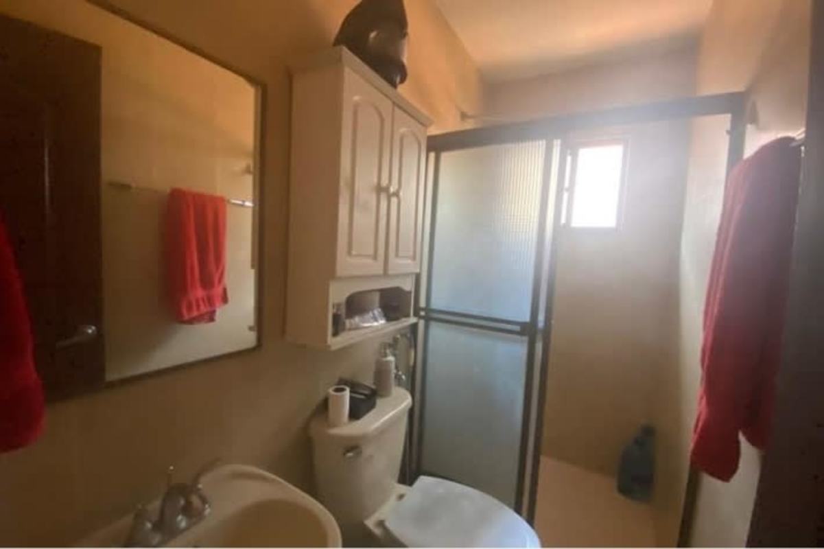 Bright sunroom with fans large windows textured wall Las Cumbres Panama