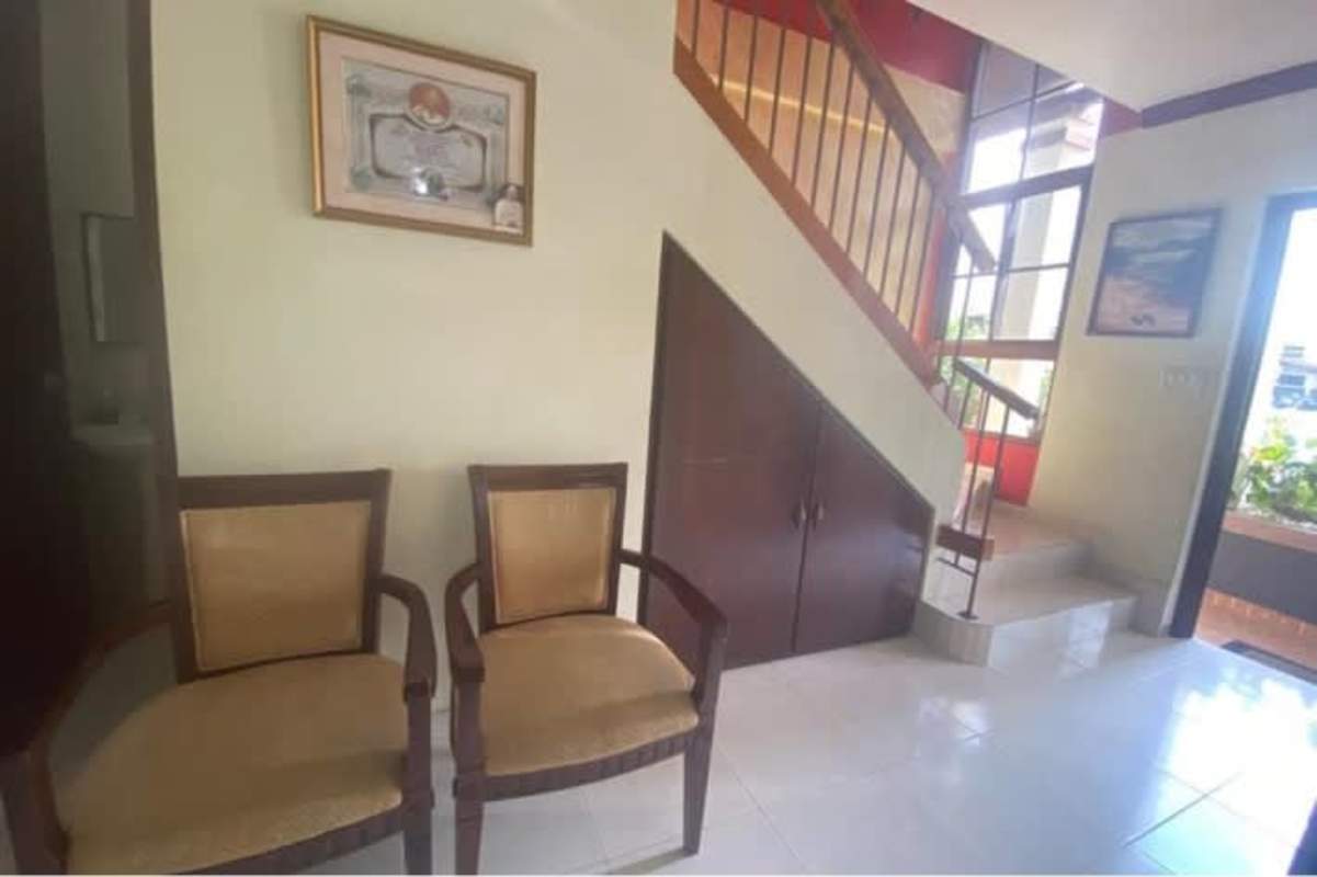 Two-story Mediterranean style house exterior with garden in Las Cumbres Panama