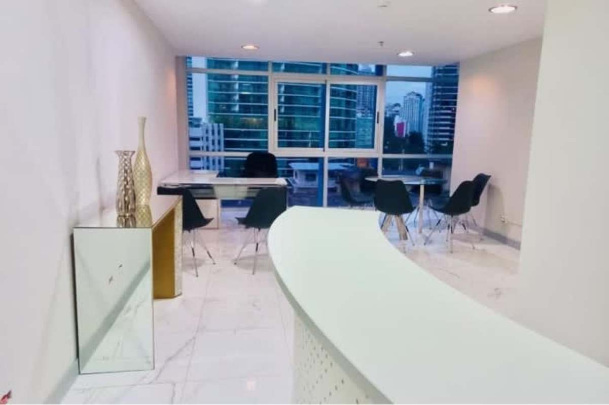 Executive glass round table meeting room with city skyline view in PH Colores de Bella Vista on Avenida Balboa