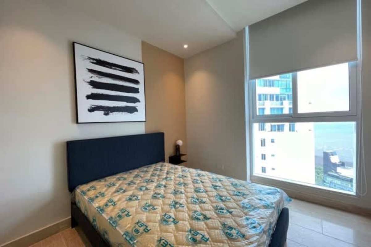 Spacious living room with floor to ceiling windows offering sea and skyline view at PH Riverside Costa del Este Panama