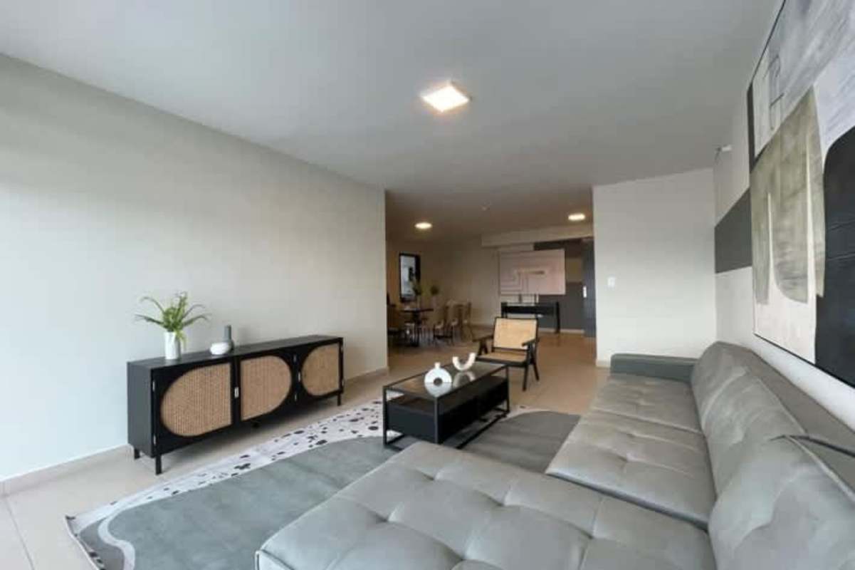 Modern bathroom with glass shower, stone sink countertop in luxury condo Costa del Este Panama