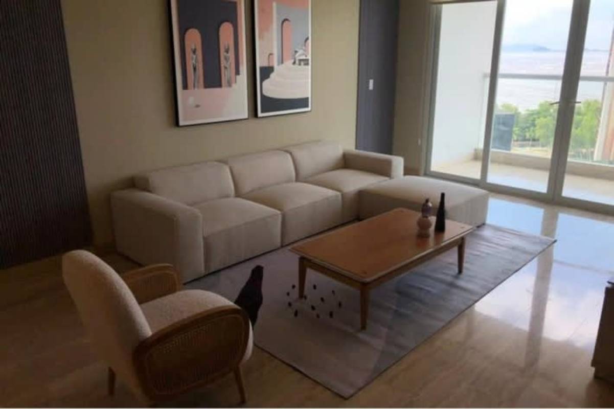 Designer dining room with marble floors, wall mirror and art in PH Privé Costa del Este Panama