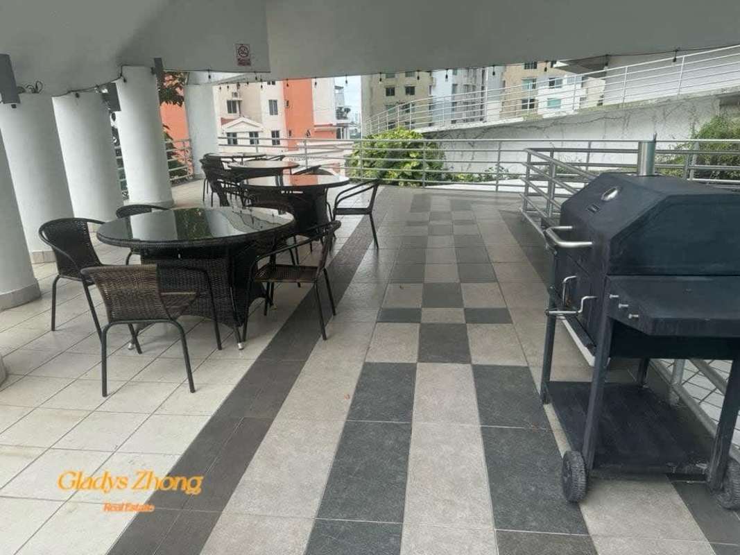 Covered outdoor patio area with tables, chairs and barbecue at PH Pacific Hills Dos Mares Panama City