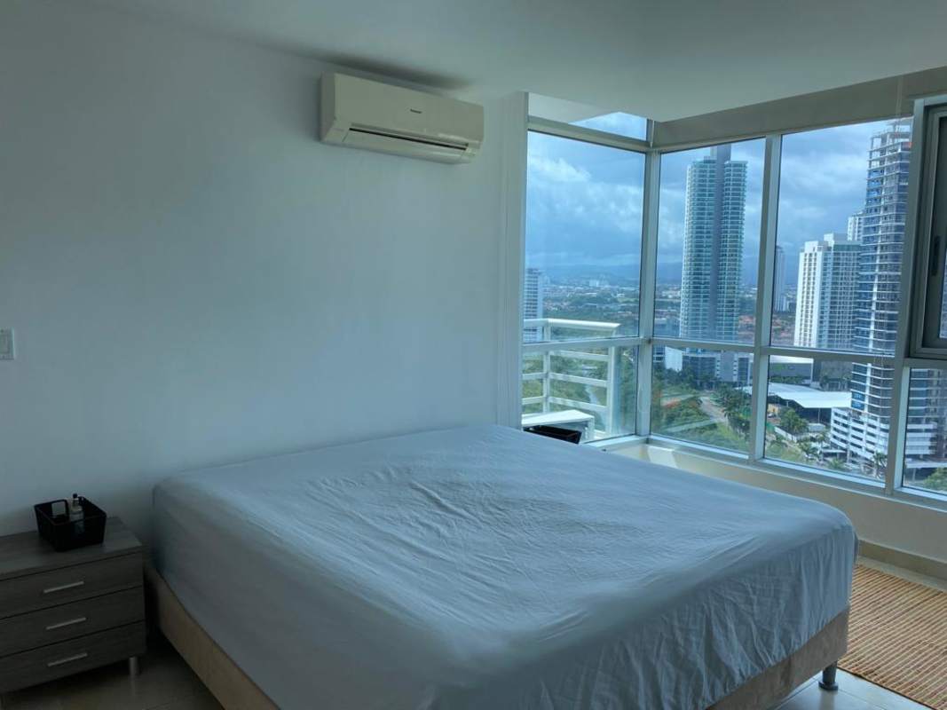 Main bedroom with queen bed, closet, panoramic windows furnished apartment Costa del Este Panama