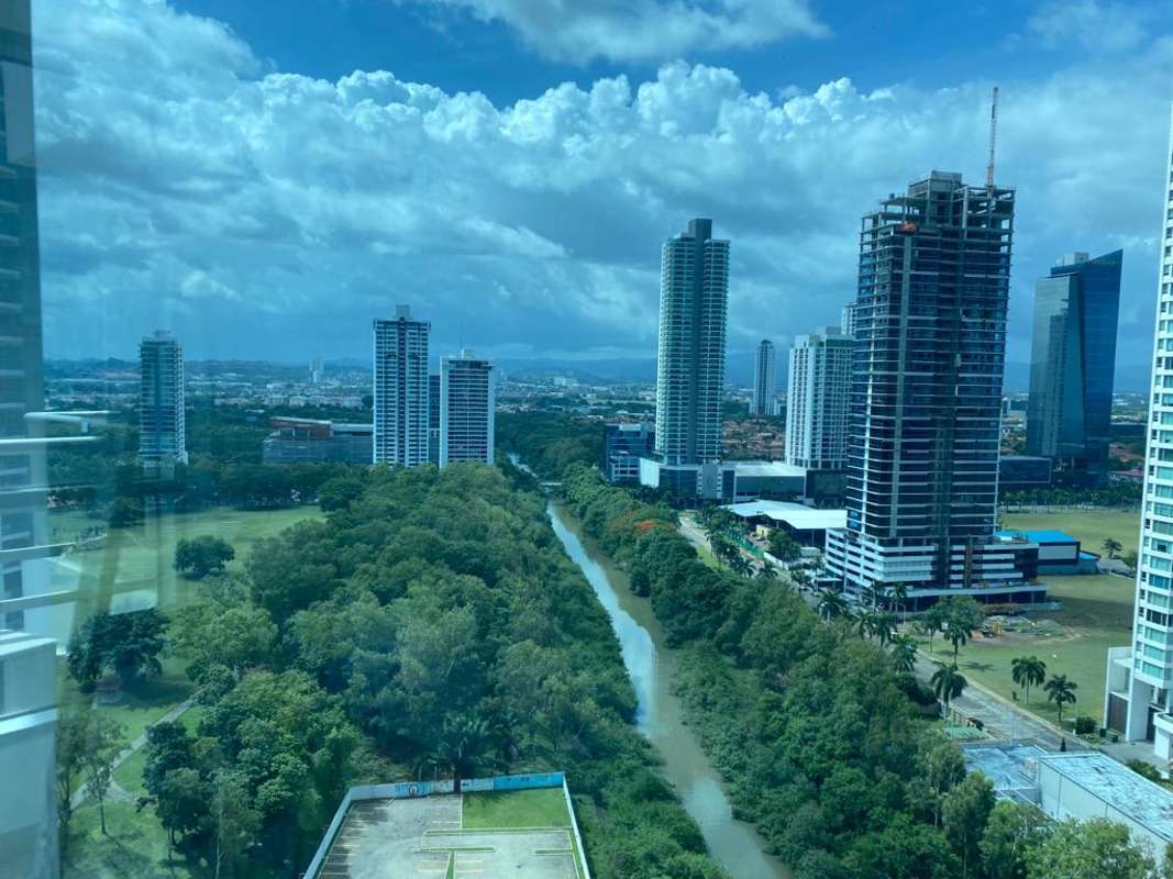 Modern bathroom with glass shower enclosure and tiled walls Costa del Este Panama rental