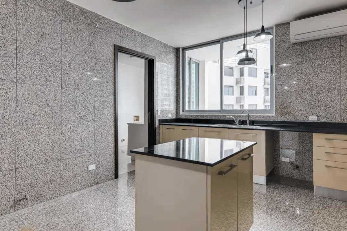 Modern apartment balcony with glass railing overlooking ocean and skyline in PH Allure Panama