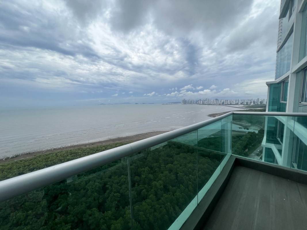 Contemporary luxury kitchen with granite counters, stainless appliances, and city views in PH Ocean Two penthouse