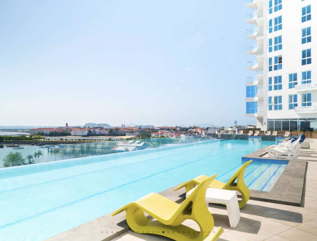 Infinity pool at night overlooking cityscape rooftop terrace PH The Sands Panama