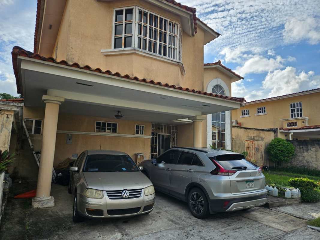 Exterior of two-story house with garage and carport Albrook Gardens Clayton neighborhood Panama