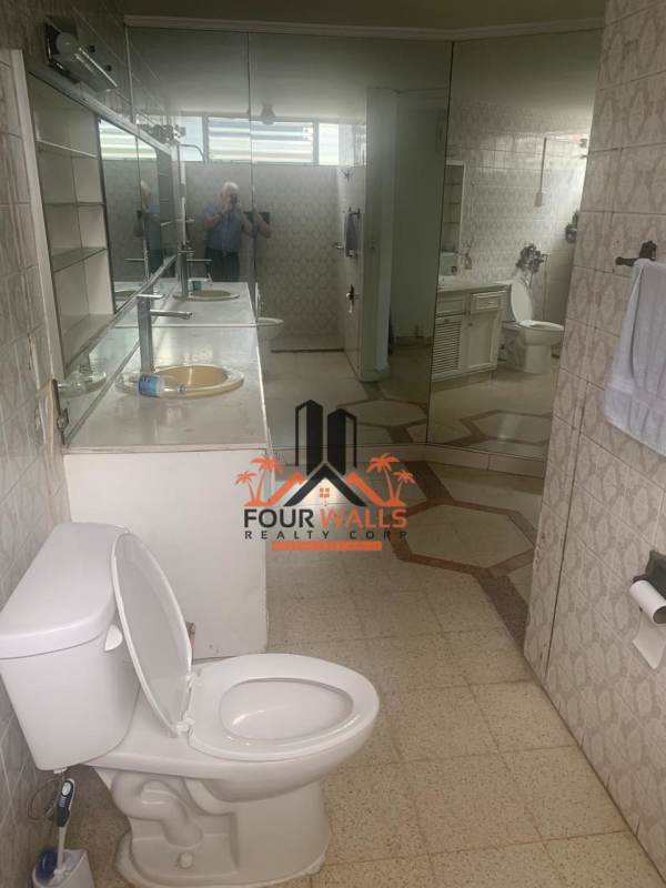 Exterior of PH Fiesta mid-rise building with balconies, parking and security gate in Panama City