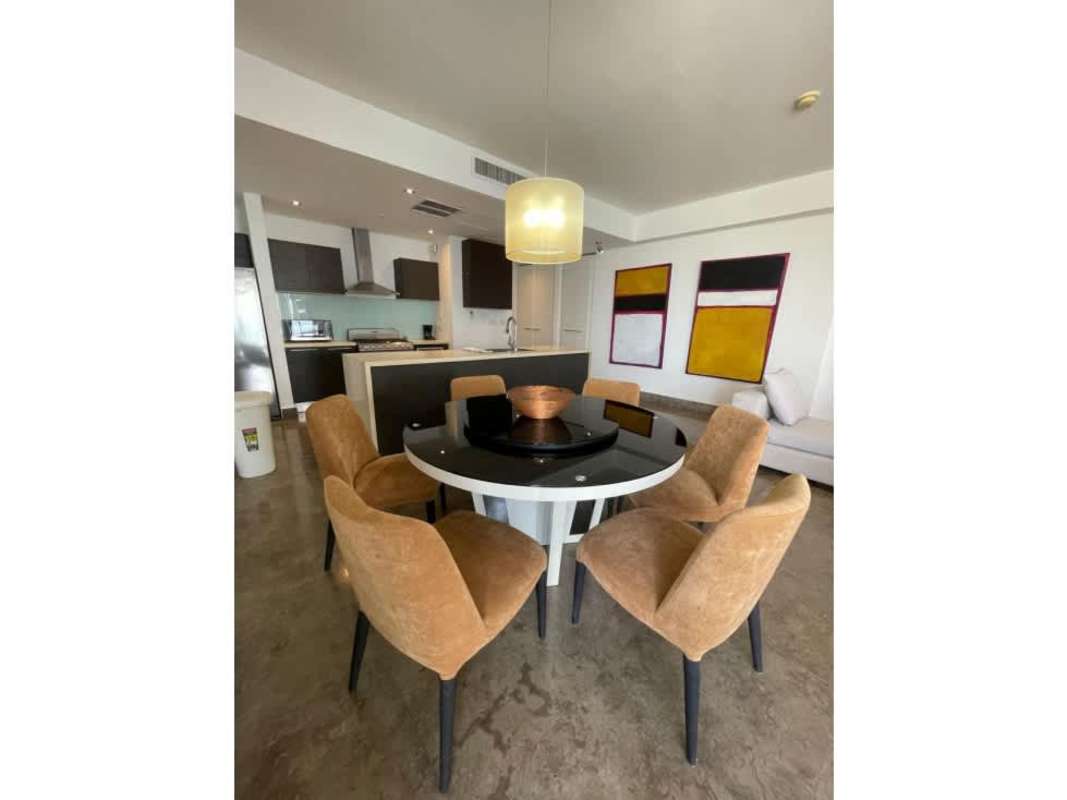 Modern open kitchen and dining area with appliances in PH Yoo Panama