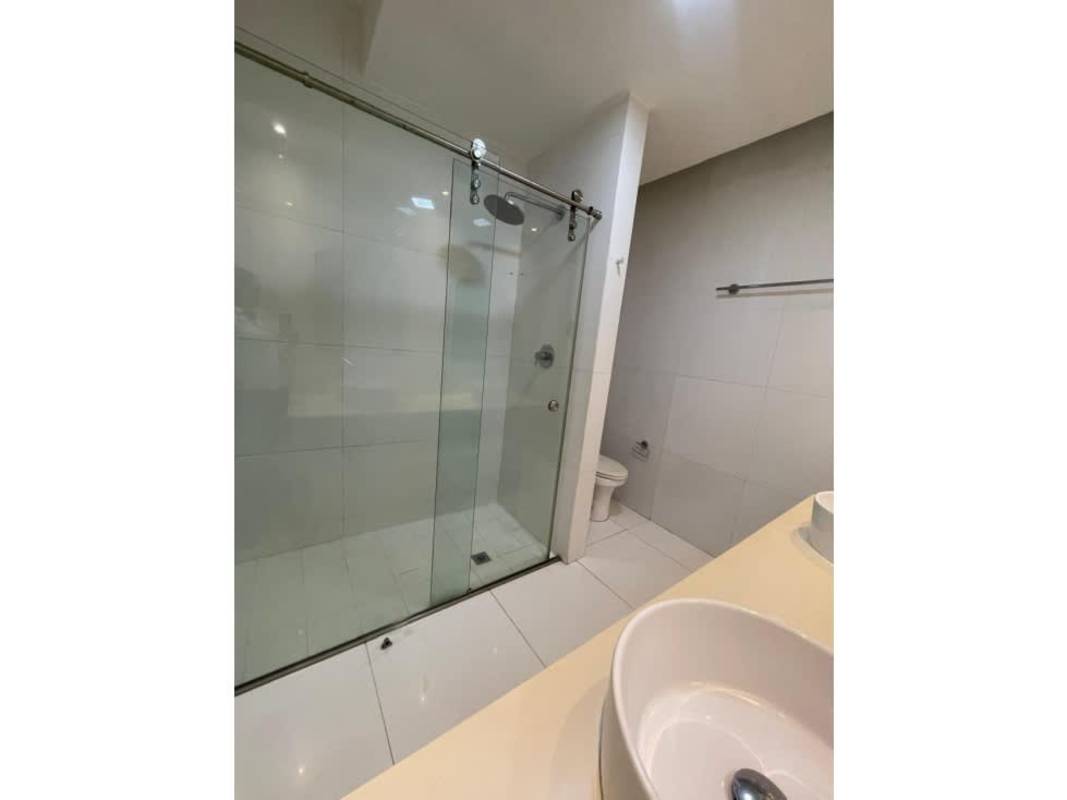 Modern bathroom with vessel sink and glass shower PH Yoo Panama