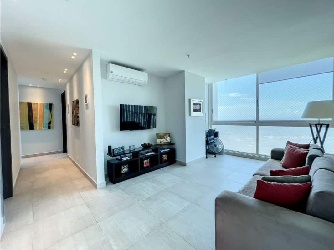 Bright living room with ocean views, minimalist decor, large windows PH Asia Costa del Este Panama
