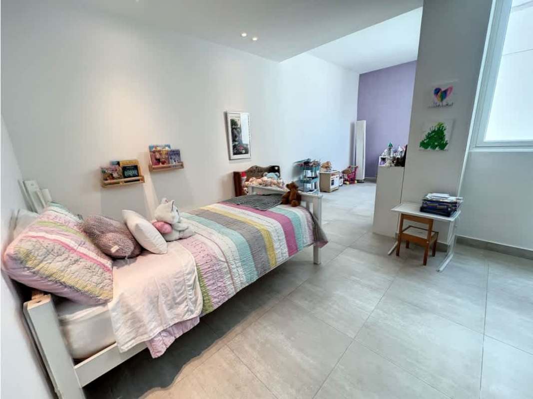Kids bedroom in penthouse condo with large windows and city view PH Asia Costa del Este