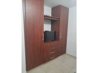 Kitchen with granite island, wood cabinets, stainless appliances PH Piedras Gordas Villages Panama