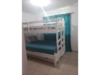 Night tropical garden with sun loungers, palm trees, pool at beach home PH Piedras Gordas Panama