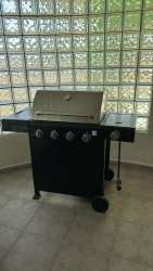 Glass block enclosed sunroom patio with BBQ grill at Coronado beach vacation house Panama