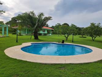 Single-story beach house with pool, palm trees and garden at Coronado Panama vacation rental