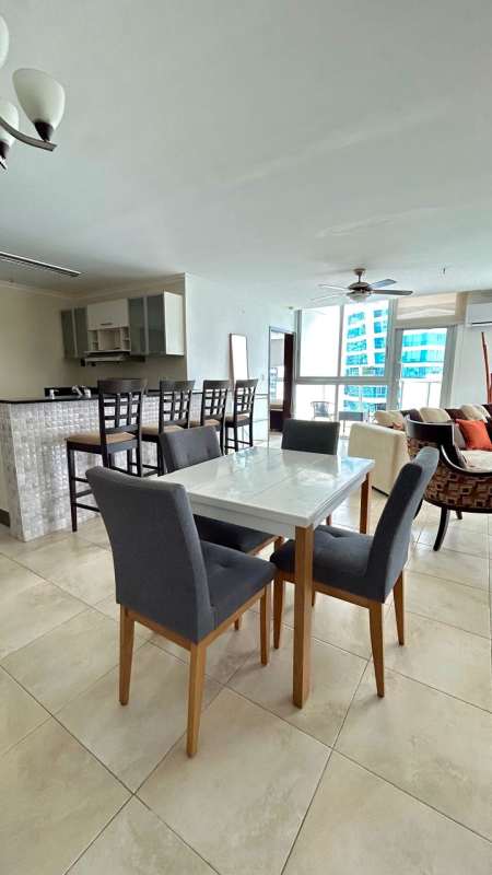 Modern open kitchen with granite counters, bar seating, stainless fridge PH Riverside Costa del Este rental