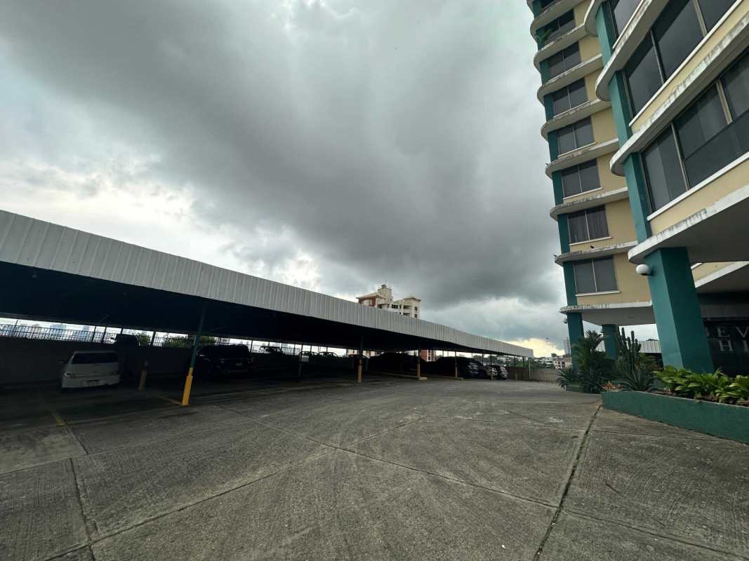 Kitchen with granite countertops dark cabinetry window natural light PH Beverly Hills Panama City