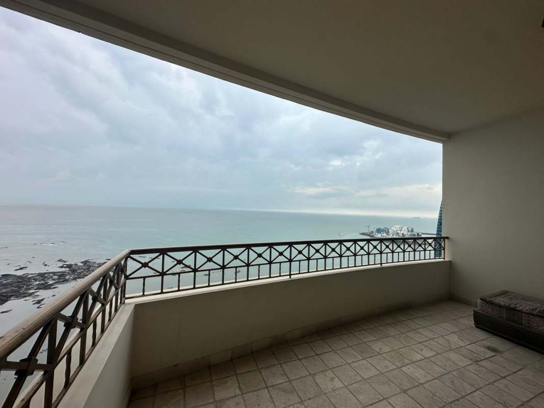 Spacious living dining space with marble floors, panoramic windows, sea view terrace at PH Pacific Point Panama