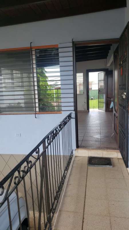 Green backyard with patio and skyline view in Betania neighborhood Panama City