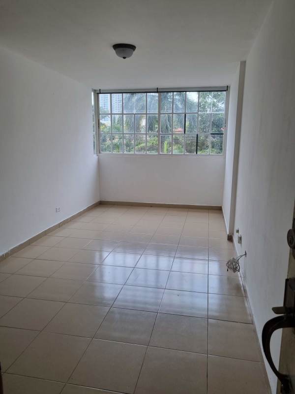 Empty bright living room with large windows tile floors Panama apartment for sale