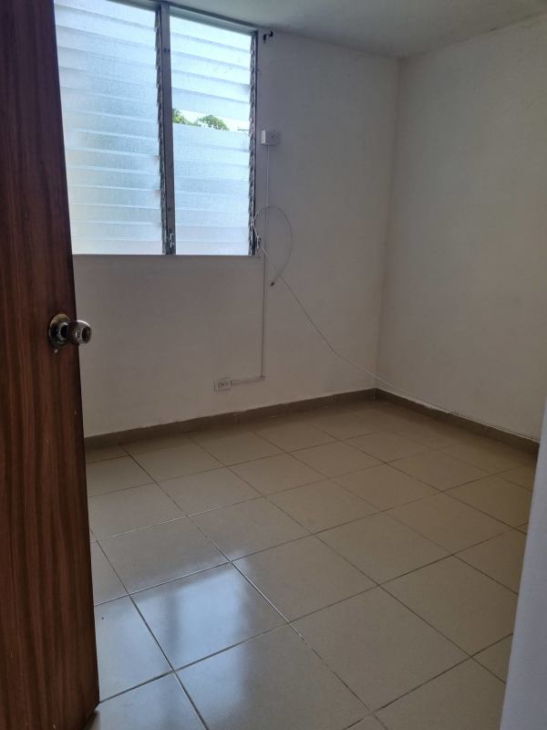 Bedroom with window natural light ceramic tile in Panama apartment Río Abajo