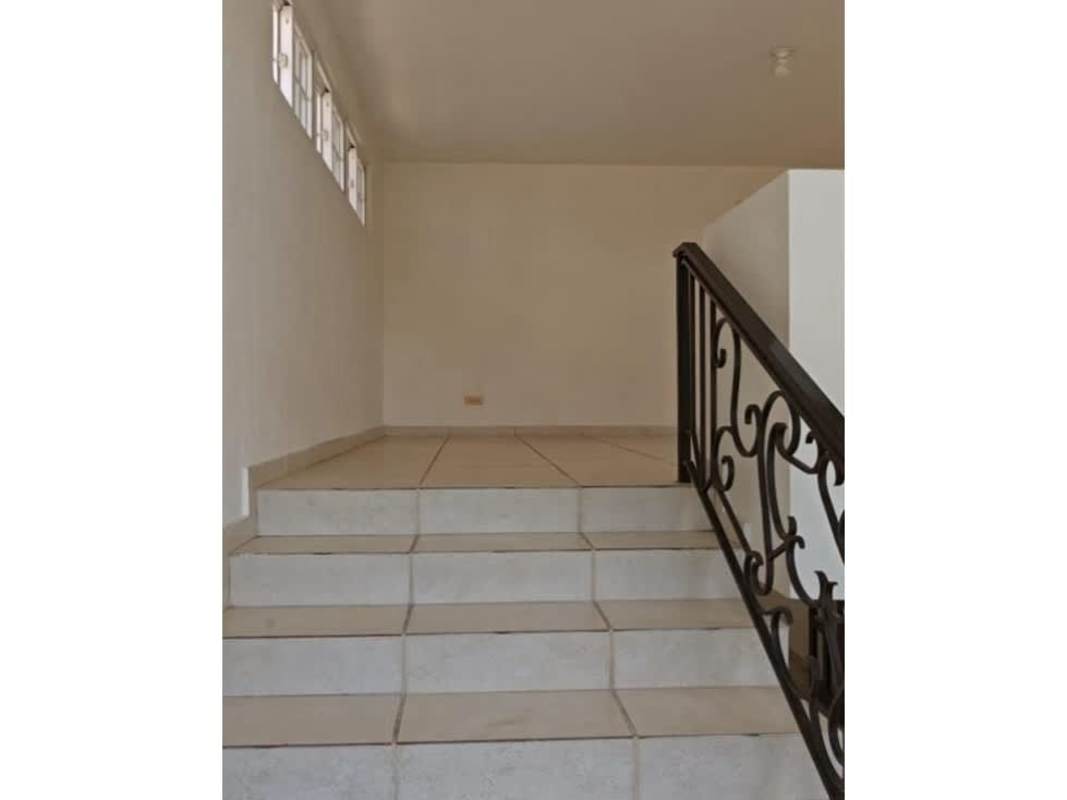 Interior staircase with wrought iron rails in house for sale Brisas del Golf Panama