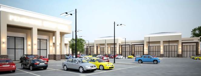 Wide view of new commercial shopping center in Penonomé featuring multiple storefronts and parking
