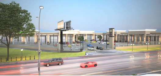 Entrance to Penonomé Shop Center commercial plaza with billboard signage and parking access