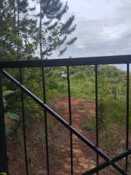 Gated entrance with dirt path and lush greenery Santa Fe Veraguas Panama