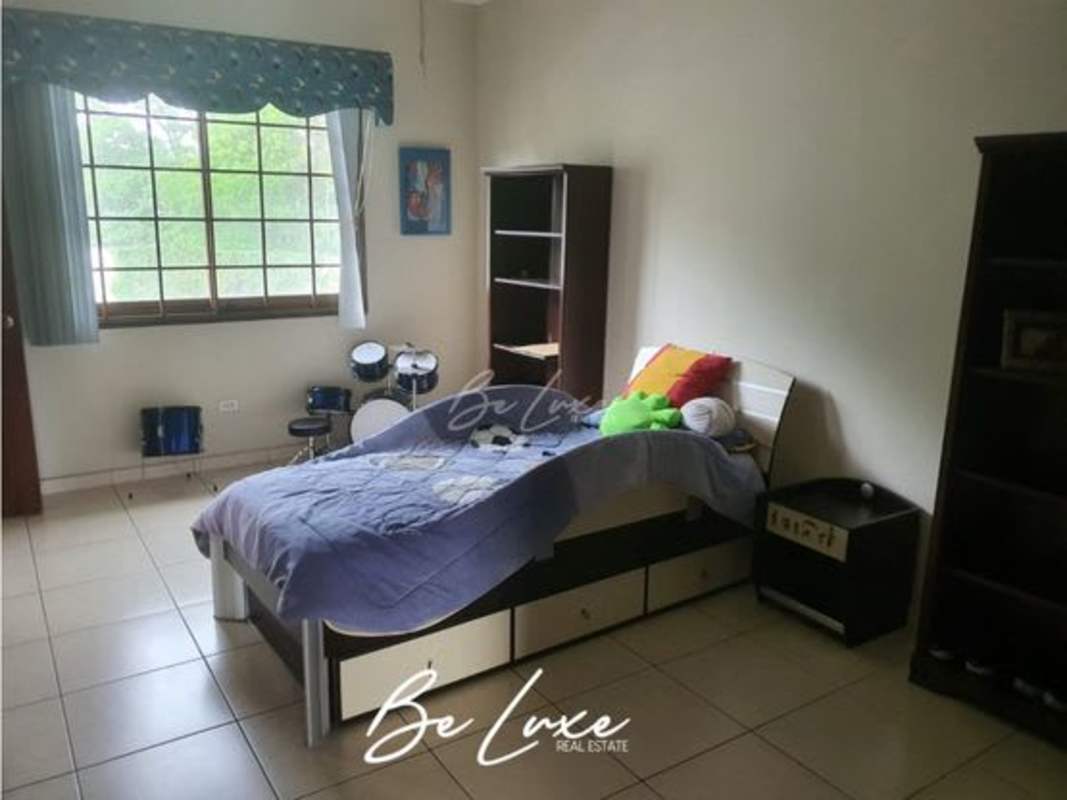 Contemporary bedroom with large window and drum kit in Camino de Cruces Clayton Panama