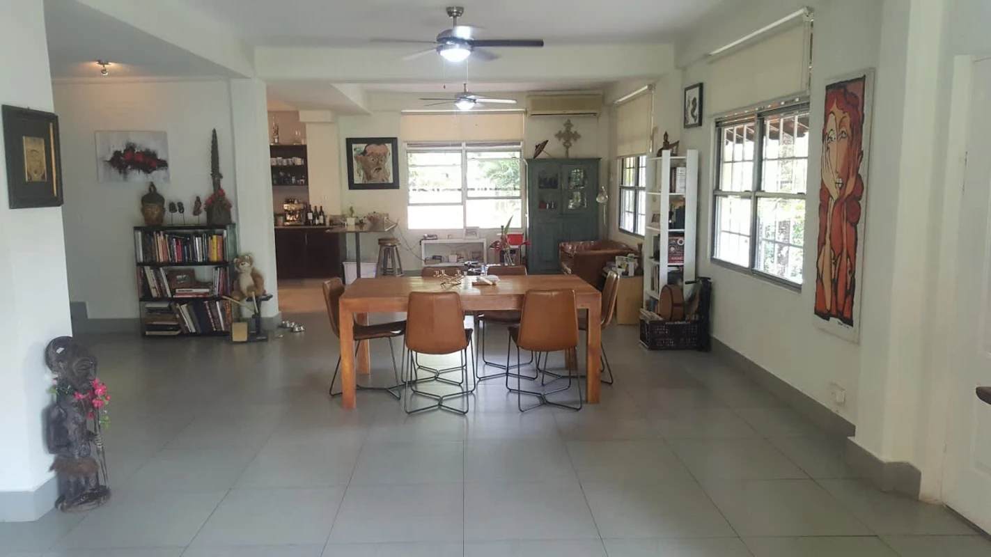 Modern bathroom with ceramic tiles, walk-in shower, granite vanity in Clayton house Panama