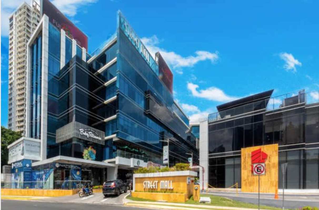 Modern multi-story glass commercial medical building with parking Punta Pacífica Panama