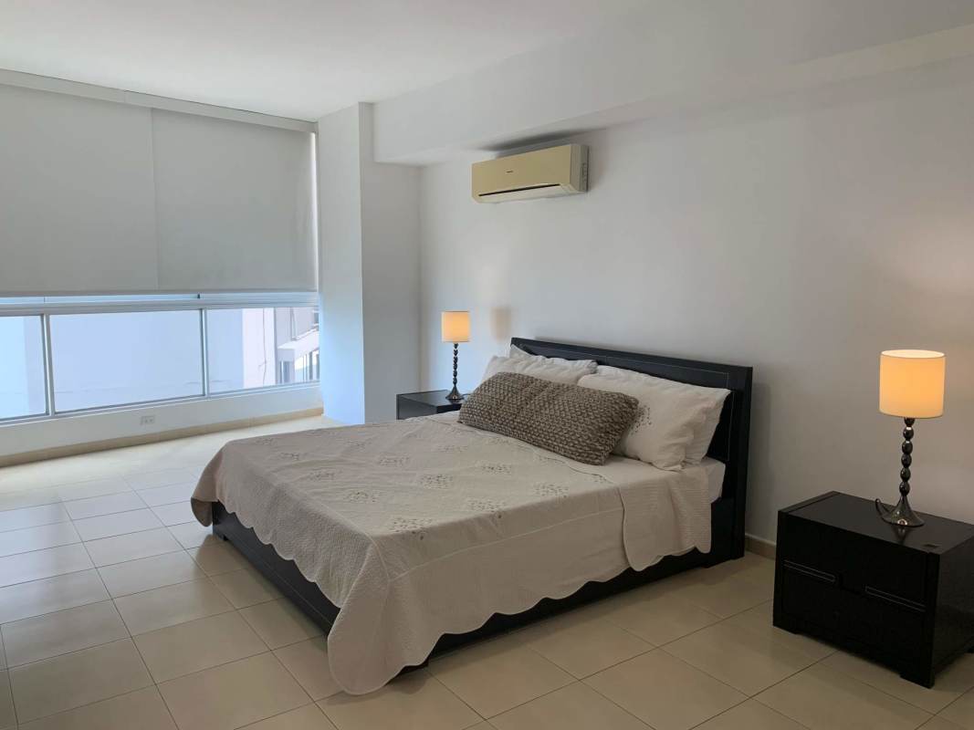 Bright bathroom with granite sink and glass walk-in shower in PH Grand Bay Tower Panama