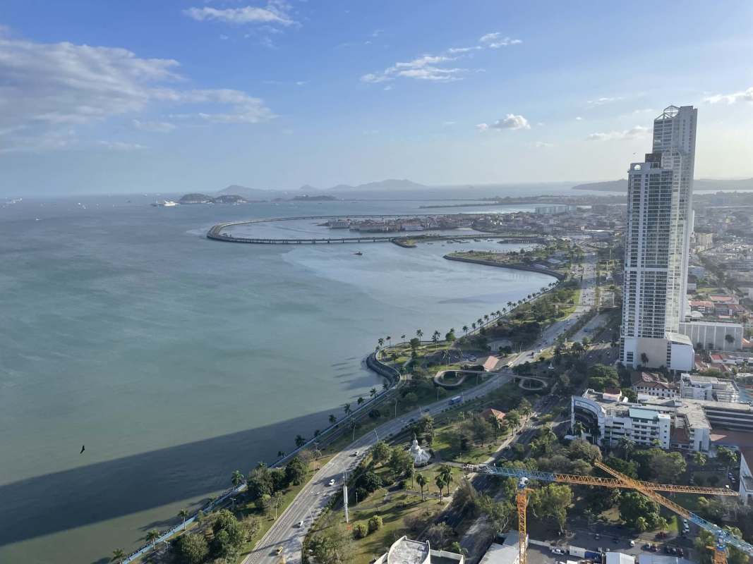 Open kitchen and living area with stainless appliances and bay views Yacht Club Tower Panama