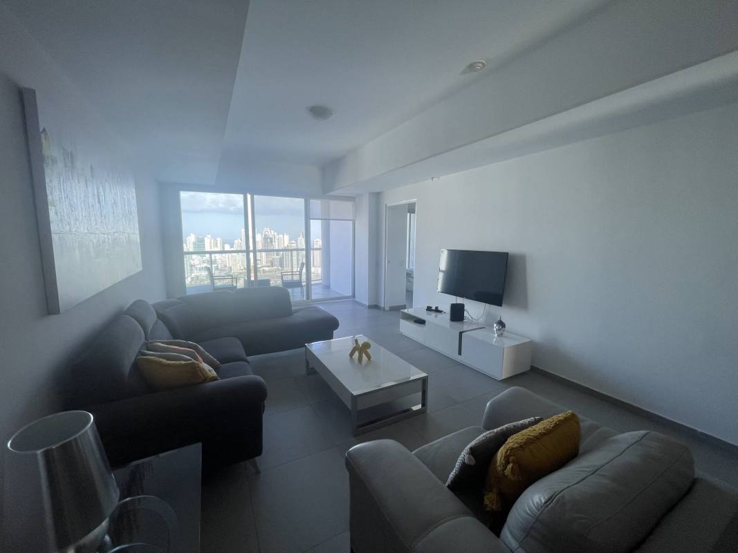 Modern living room with panoramic bay views floor-to-ceiling windows Yacht Club Tower Panama