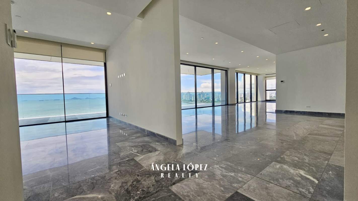 Fully equipped modern kitchen with marble countertops central island built-in appliances at PH Upper East Costa del Este Panama