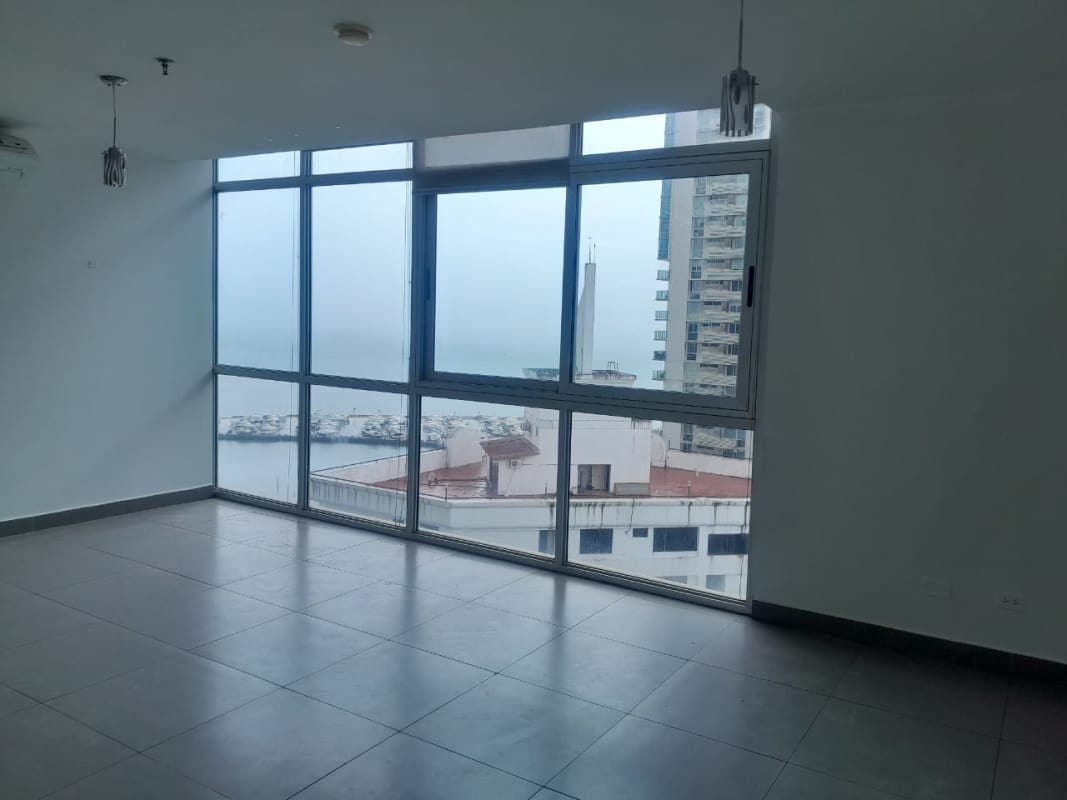 Balcony view of marina, city skyline, ocean at PH Colores de Bella Vista Avenida Balboa Panama City