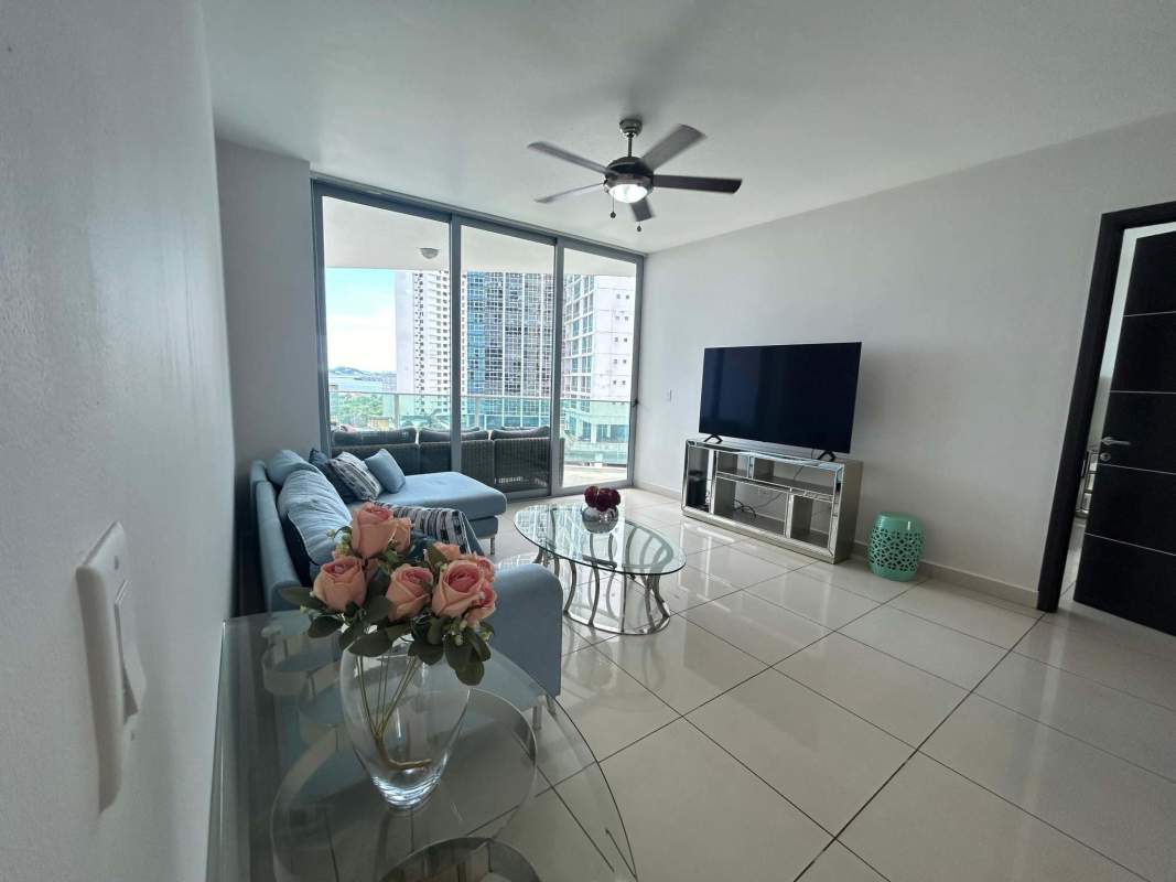 Living area featuring sectional sofa and TV with floor-to-ceiling windows PH Allure Panama