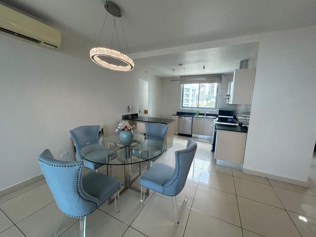 Open-concept dining and kitchen area with modern appliances in PH Allure