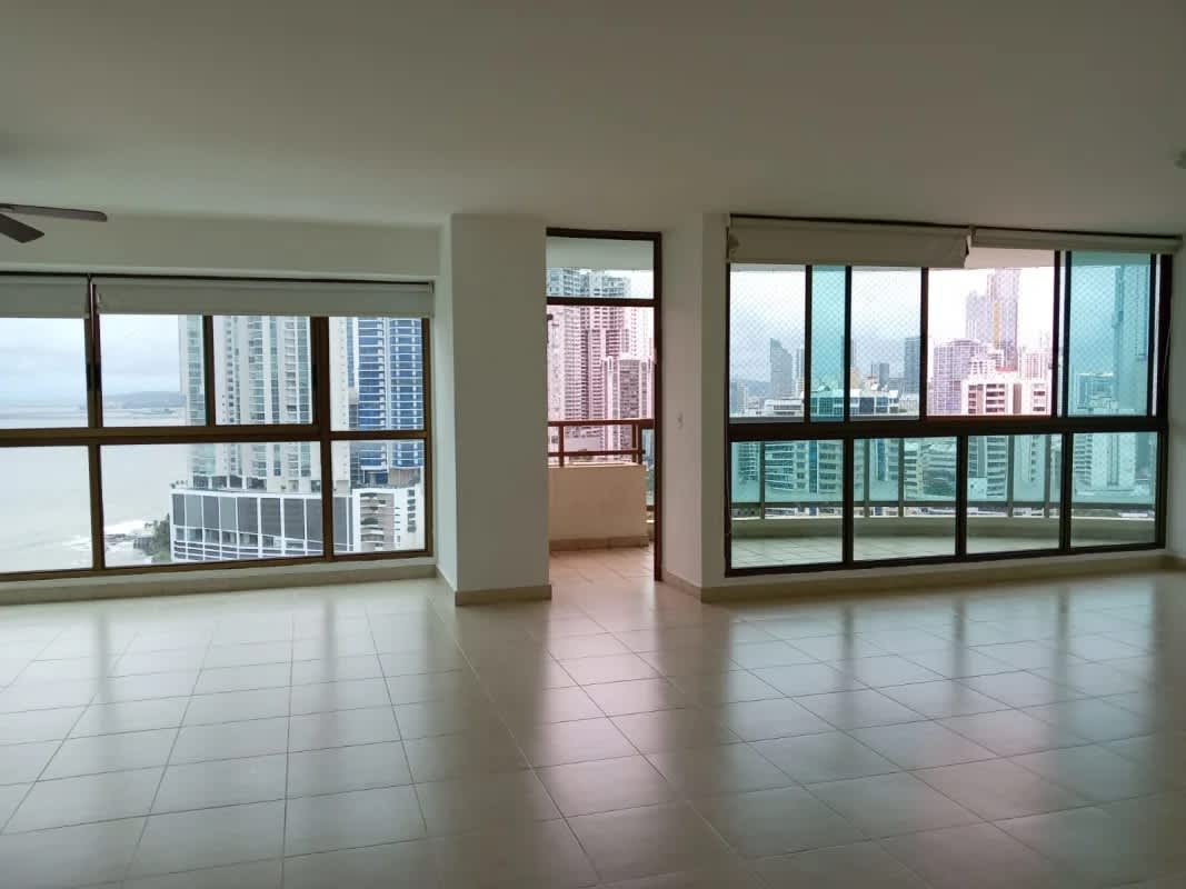 Spacious open living room with high ceilings and large windows at PH Ocean Park Panama
